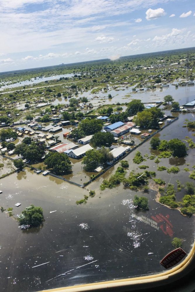 In this photo taken Thursday, Oct. 17, 2019 and released by Medecins Sans Frontieres, their primary healthcare centre is shown surrounded by floodwaters in Pibor, seen from the air, in South Sudan. South Sudan's president on Tuesday, Oct. 29, 2019 declared a state of emergency in 27 counties because of the flooding and parts of the East African region are bracing for a tropical storm that could worsen an already dire humanitarian situation. (Medecins Sans Frontieres via AP)