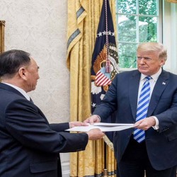 Donald Trump is presented with a letter from North Korean Leader Kim Jong Un, Friday, June 1, 2018, by North Korean envoy Kim Yong Chol in the Oval Office at the White House in Washington, D.C., followed by a meeting. (images by Shealah Craighead)