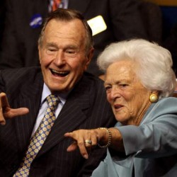 Former President George H.W. Bush and first lady Barbara Bush point from their seats on day two of the Republican National Convention on September 2, 2008 in St. Paul, Minnesota. (Photo by Justin Sullivan - Getty Images)