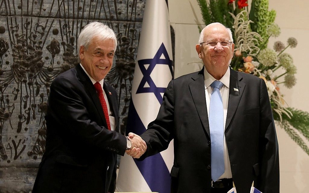 President Reuven Rivlin (R) and his Chilean counterpart Sebastian Pinera shake hands prior to their meeting at the President's Residence in Jerusalem on June 26, 2019. (Gali TIbbon/AFP).
