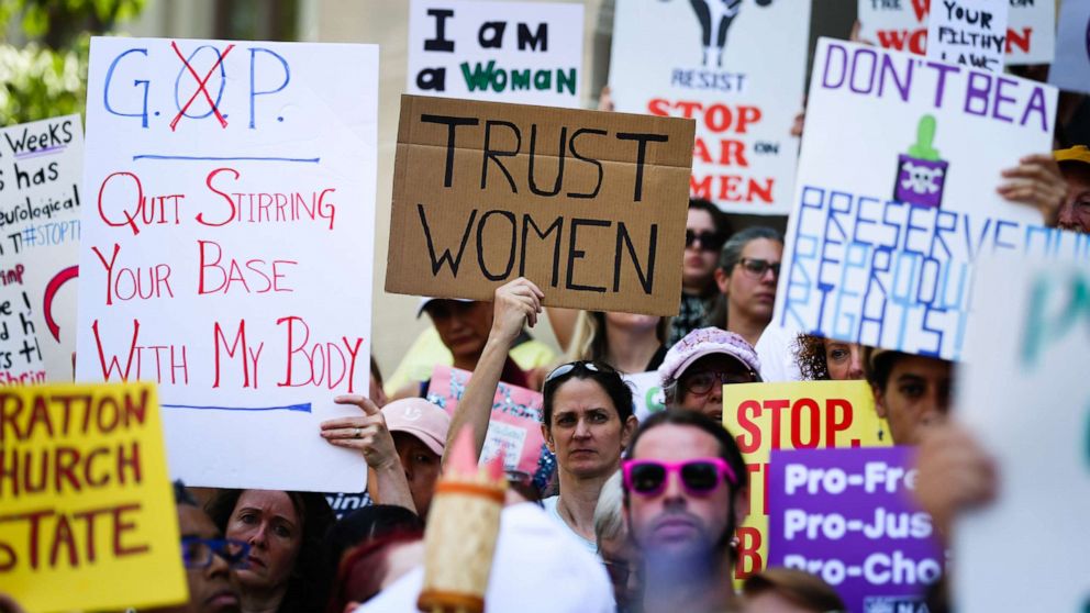Women hold signs during a protest against recently passed abortion ban bills at the Georgia State Capitol building, in Atlanta, May 21, 2019 (Elijah Nouvelage/Getty Images)