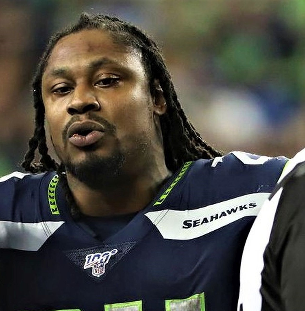 Former teammates with the Seattle Seahawks, Richard Sherman and Marshawn Lynch, are two of the owners in a new football league. (Getty Images)