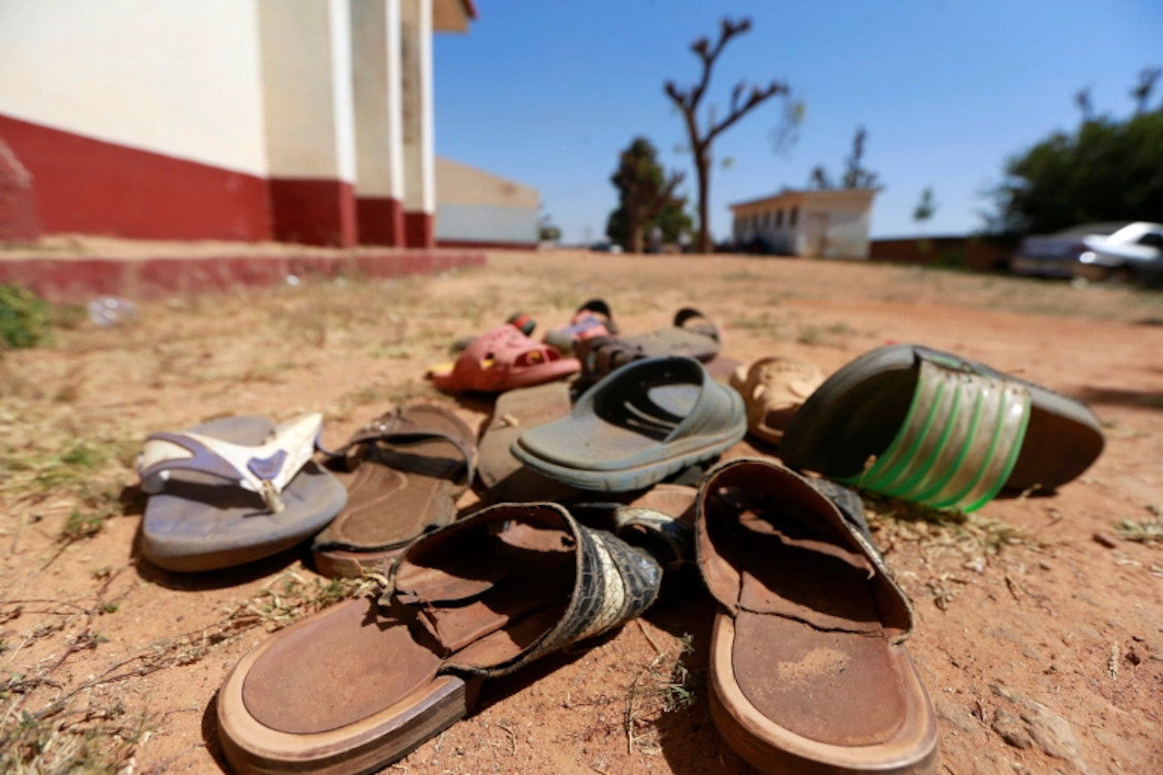 The attackers, dressed in military uniforms and masks, stormed the school hostels to take away children, local media reported (Image by Afolabi Sotunde/Reuters)