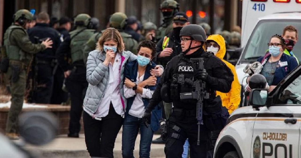 People walk out of a King Soopers grocery store in Boulder, Colorado, after a shooting there on Monday. (Getty Image)