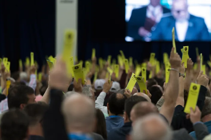 Attendees hold up their ballots during a session at the Southern Baptist Convention's annual meeting in Anaheim, Calif., Tuesday, June 14, 2022. (AP Photo/Jae C. Hong)