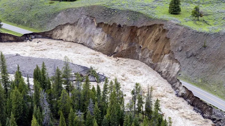 This aerial photo provided by the National Park Service shows a flooded out North Entrance Road, of Yellowstone National Park in Gardiner, Mont., on June 13, 2022. (Image AP/Jacob W. Frank/National Park Service)